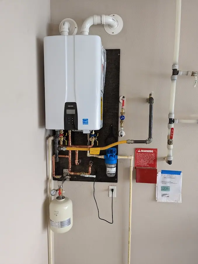 Professional plumber installing copper piping in a Paramus home